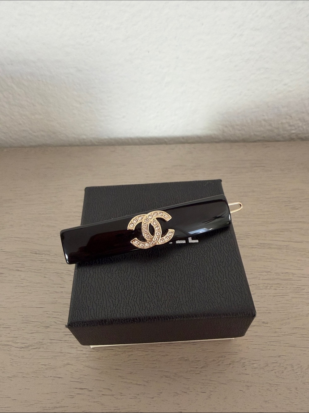 CHANEL Black Resin Hair Clip with Gold Crystal CC Logo